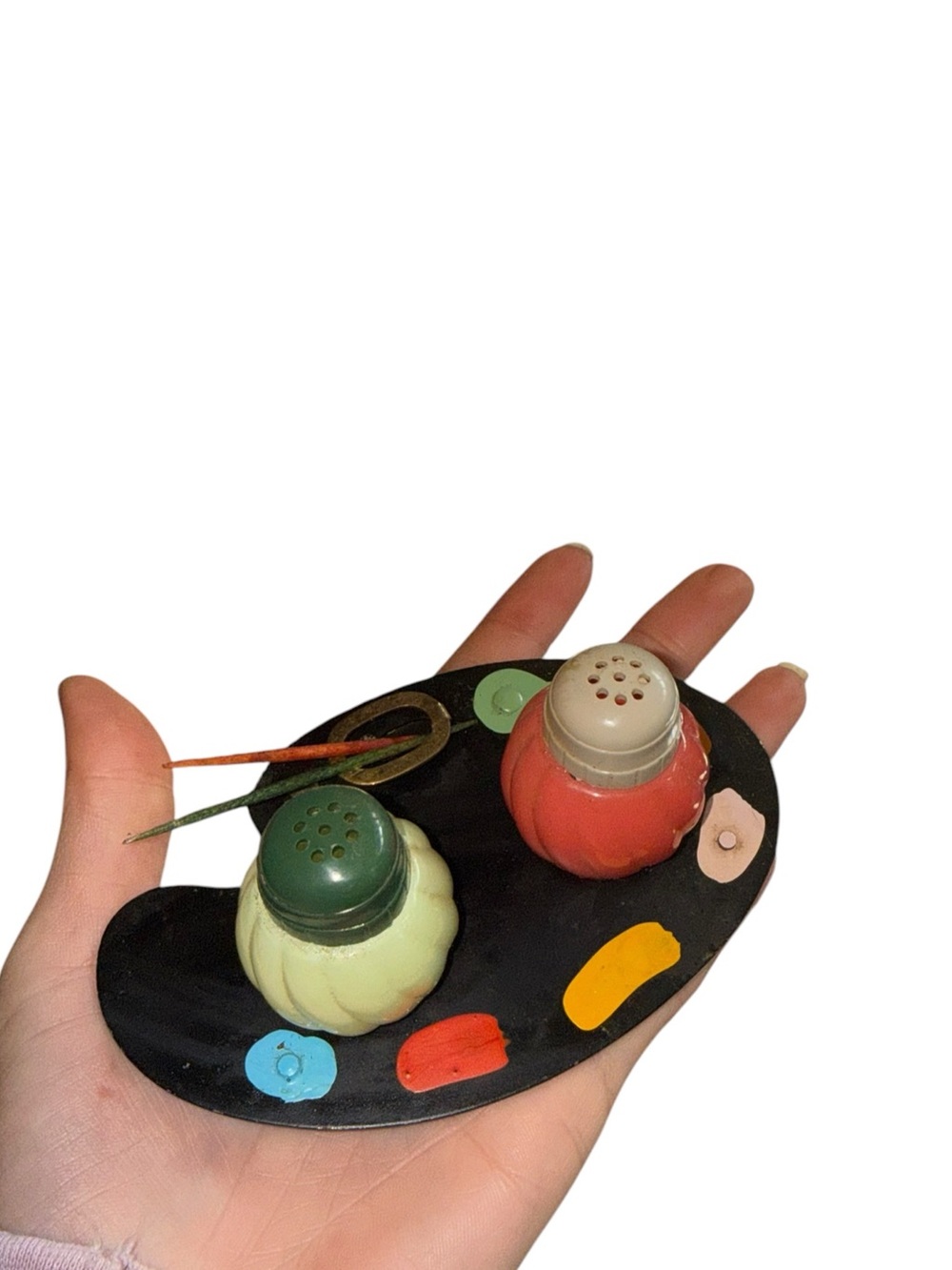 Vintage paint palette with salt and pepper shakers